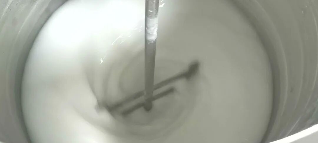 Mechanical agitation using a handheld mixer to homogenize a layered defoamer emulsion